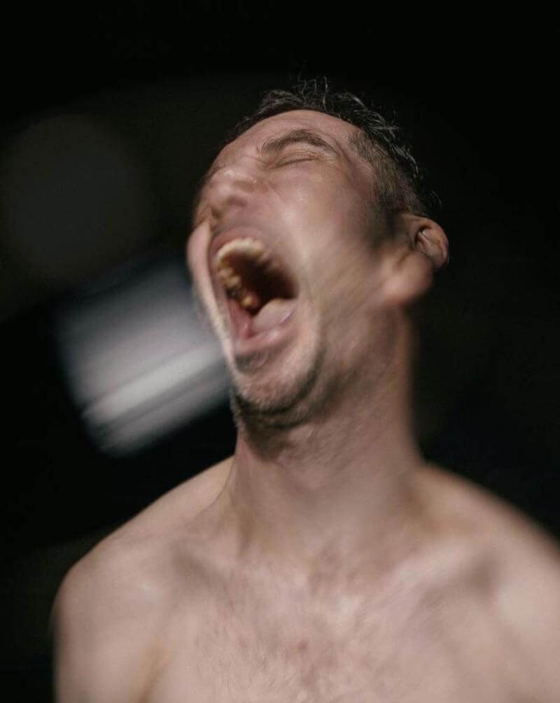 Poster for 4.48 Psychosis featuring the naked torso of a man screaming.